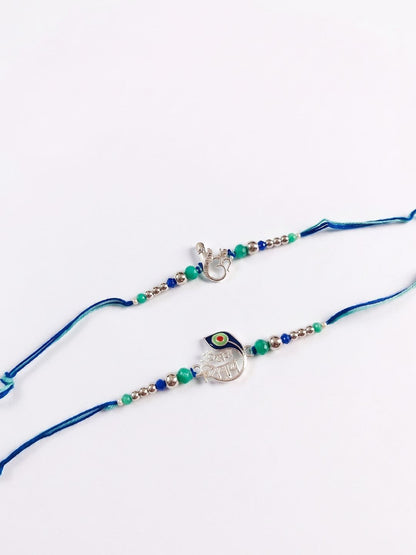 Anouk Set Of 2 Silver Toned Beaded Religious Thread Rakhi With Roli Chawal Chandan Mishri
